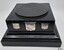 Square black glossy plinth with three silver engraved shields