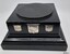 Square black glossy plinth with three silver engraved shields