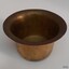 Metal bowl is hollow and has broad edges