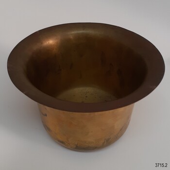 Metal bowl is hollow and has broad edges