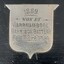 Silver shield on the trophy's black plinth