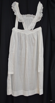 Apron has bib and shoulder straps, with back closure