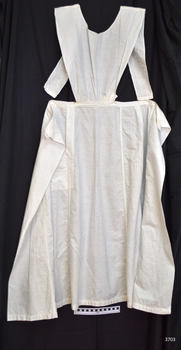Plain long cotton apron with bodice and waist ties, and a small pocket