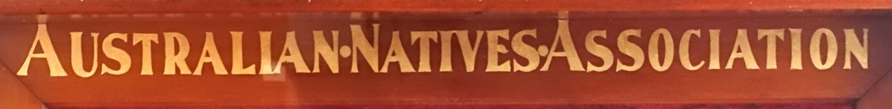 Gold leaf text on timber frame of case