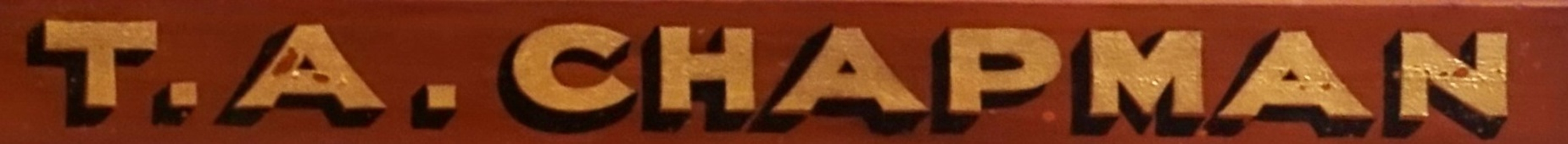 Gold leaf text on timber advertising the maker's name