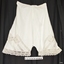 Bloomers have short leg with lace trim. Lace is also inserted into the fabric in the thigh area