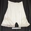 Bloomers have short leg with lace trim. Lace is also inserted into the fabric in the thigh area