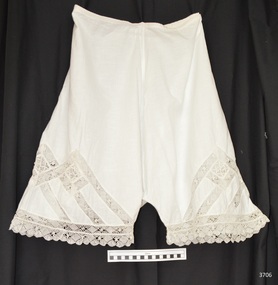 Bloomers have short leg with lace trim. Lace is also inserted into the fabric in the thigh area