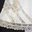 Intricate lace has been used for the trim on the bloomers