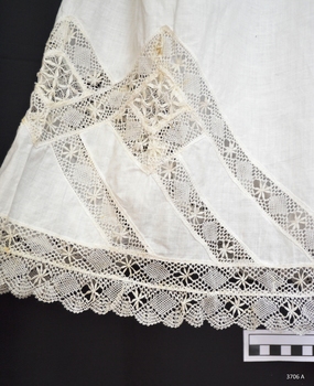Intricate lace has been used for the trim on the bloomers