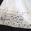 Intricate lace design on inserts and leg trim