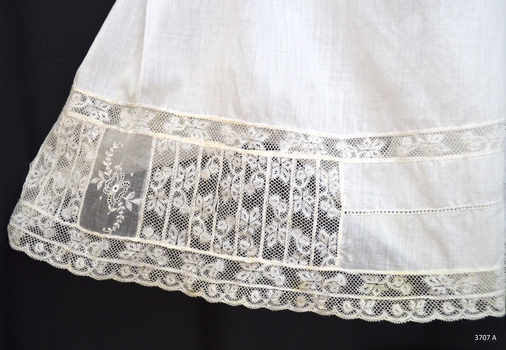 Intricate lace design on inserts and leg trim