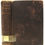 Brown fabric hardcover book with embossed gold test on spine