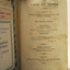 Inscriptions on the Fly page include black printed text, handwritten text and two stamps