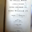 Black print on page, with stamp and handwritten inscription