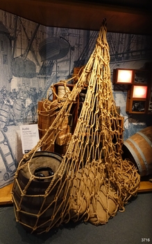 Net's contents from a different angle, with wharf scene in the background