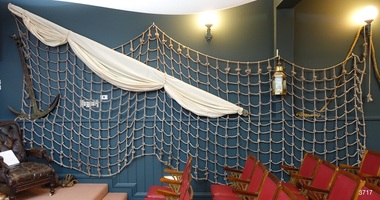 Cargo net spread wide along a wall