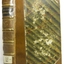 Diagonal light and green striped cover on hardcover book with brown reinforced spine and corners
