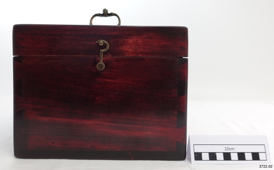 Front of compass box, latch closed, handle upright