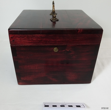 Wooden box with brass handle and hardware