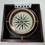 Round compass within fitted box base, from above