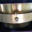 Side of metal compass, showing inscriptions