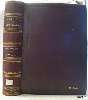 Brown hard covered book with embossed gold letters