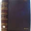 Hard brown cover with gold embossed text