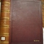 Hard cover with gold embossed text