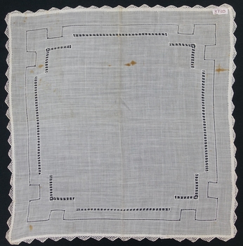 White cotton fabric with crochet edge and drawn thread needlework