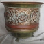 Copper jardiniere or plant pot, round, three feet, decorative floral design