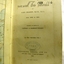 Black text, black handwriting and blue stamp on page