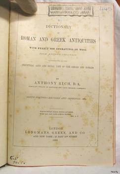 Fly page has black print, handwritten inscriptions and a stamp