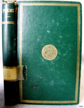 Emerald green hardcover book with gold border and round decal on front. Spine has embossed gold text