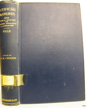 Blue cloth hardcover book with embossed lines and text on the spine