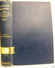 Blue cloth hardcover book with embossed lines and text on the spine