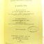 Black text with oval stamp and handwritten black ink