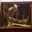 Photograph of maker Jim Williams working on the model