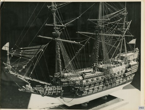 Semigloss sepia photograph of the model ship "Sovereign of the Seas" from a side view. 