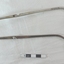 Stainless steel De Jardins stone holding forceps. There is a slight angle on the ends which are hollow. The separate parts fit together with a pin and hole and a clip clamps them shut.  