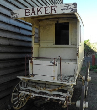 Front of baker's wagon with driver's step and awning