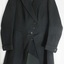 Black fabric, long single breasted jacket with button closure