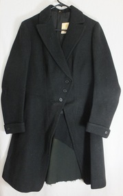 Black fabric, long single breasted jacket with button closure