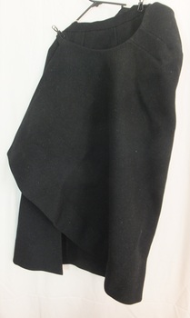 Front of dark fabric skirt has a cross-over flap