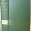 Textured green hard cover with gold embossed title and white label