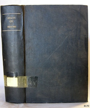 Black cloth hardcover book with embossed gold print on the spine