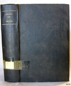 Black cloth hardcover book with embossed gold print on the spine