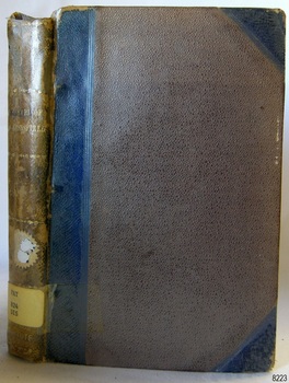 Brown cloth hardcover book with blue reinforcing on spine and corners