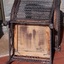 Underside base of the chair, reinforced, with brush-strokes of dark paint