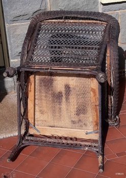 Underside base of the chair, reinforced, with brush-strokes of dark paint